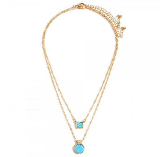 Gold Layered Necklace Featuring Natural Stone Pendants.