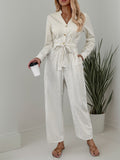 Striped Notched Long Sleeve Tie Waist Jumpsuit